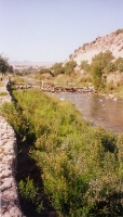 Woman Crossing River